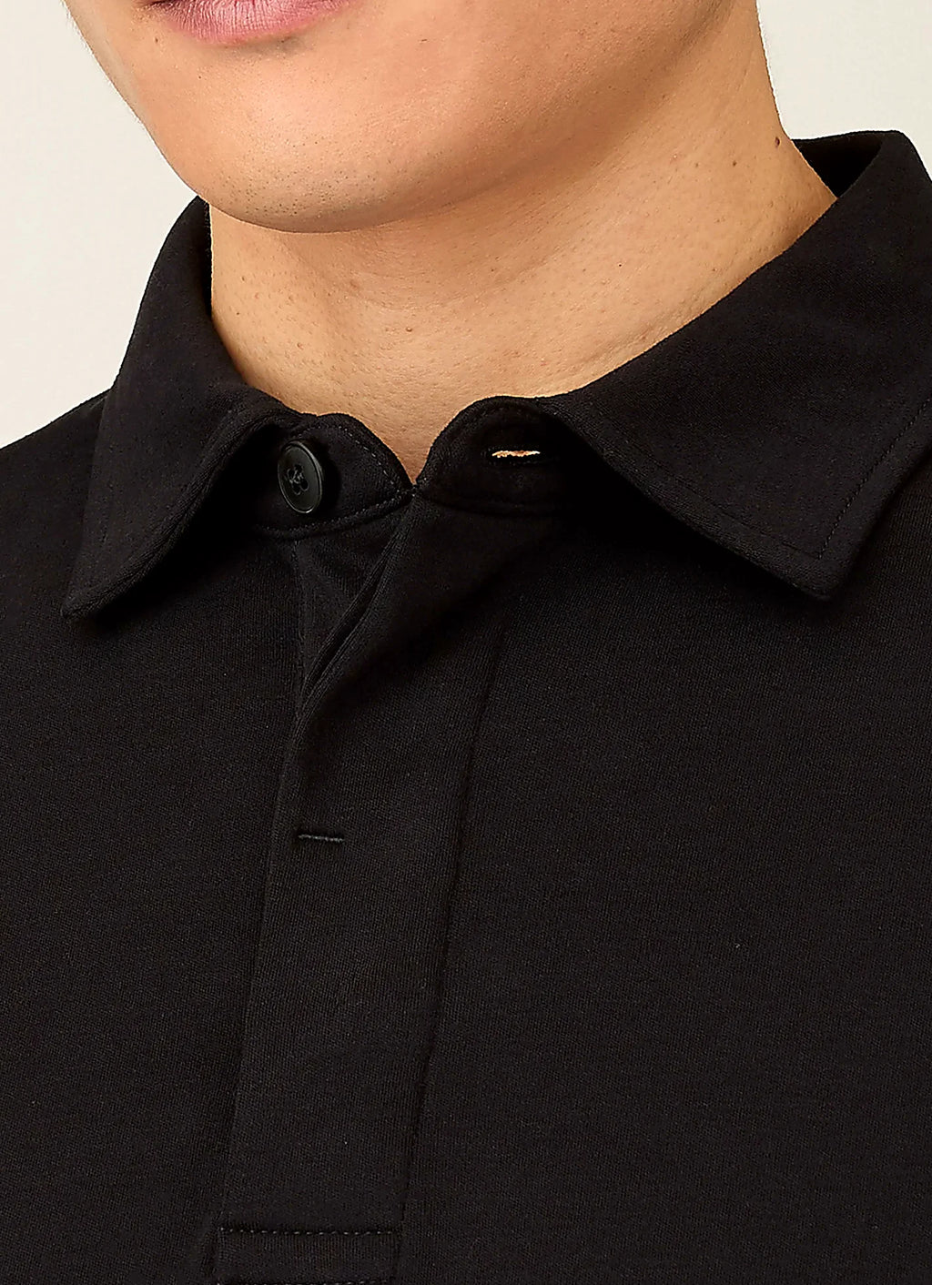 Black rugby polo shirt for a men's wardrobe
